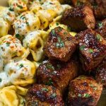 Garlic Butter Steak Bites with Creamy Parmesan Tortellini and Garlic Sauce